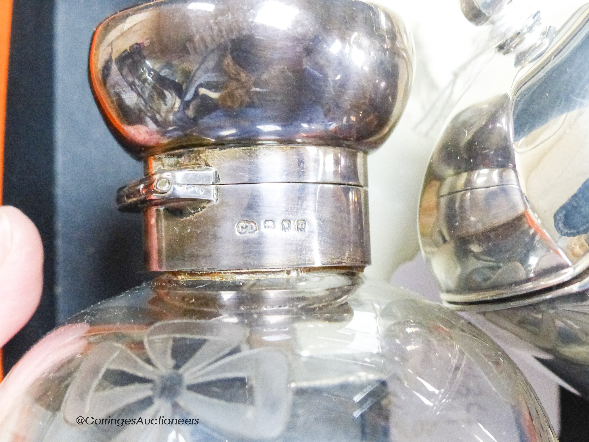 A George V panelled silver tea caddy, Sheffield, 1918, 10.2cm, a late Victorian silver bowl, a silver mounted glass scent bottle, a modern silver mounted photograph frame and a plated coin dish.